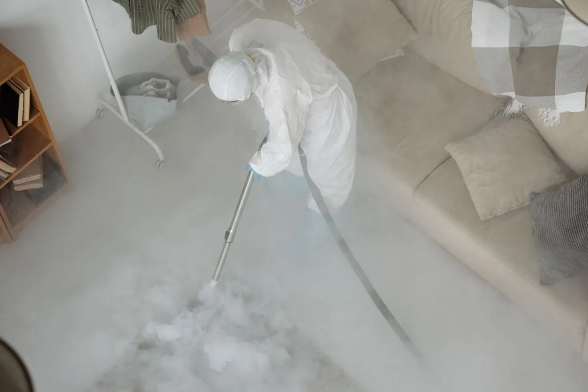 Biohazard cleanup technician in protective equipment, Ida, MI